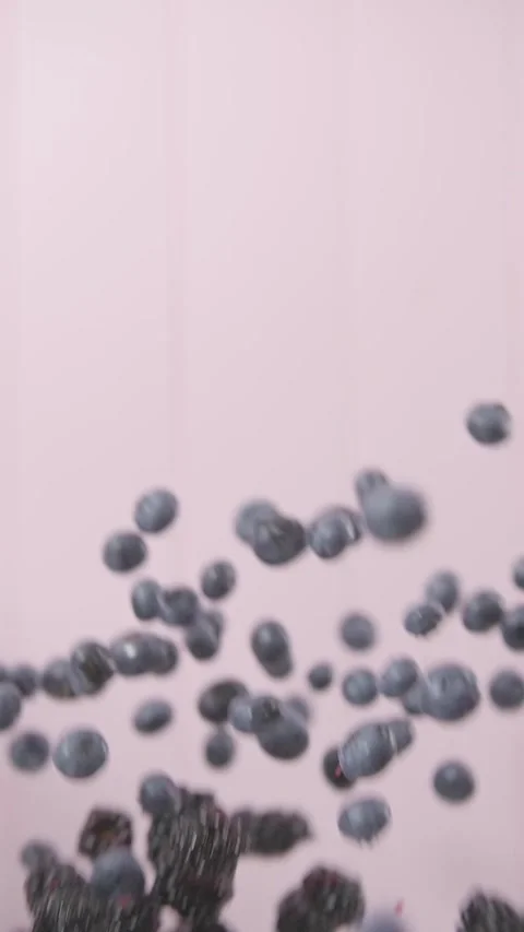 Blend of blue and black berries fresh ingredients splashing Stock Footage 270135129