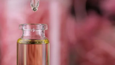 Blend of essential oils closeup. Making some aroma liquids, perfume. Stock Footage