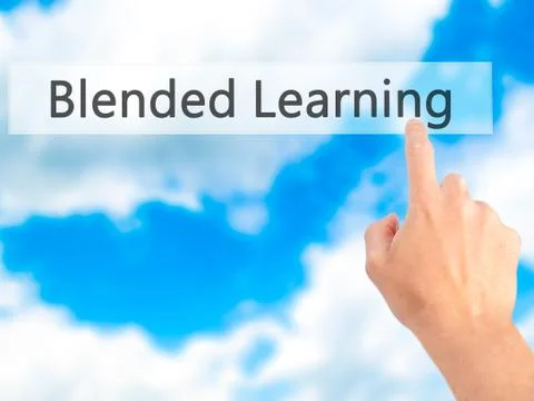 Blended Learning - Hand pressing a button on blurred background concept on vi Stock Photos