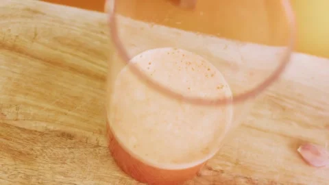 Blended red pepper mixture standing in a transparent beaker, 4K Stock Footage 341122541