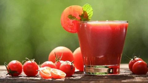 Blended tomato juice with slice tomatoes in glass Stock Footage 126960385