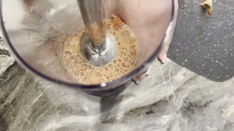 A blender is being used to make a drink in a glass 스톡 동영상 279299515