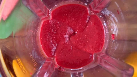 Blender with fresh smoothie on table Stock Footage 107809588