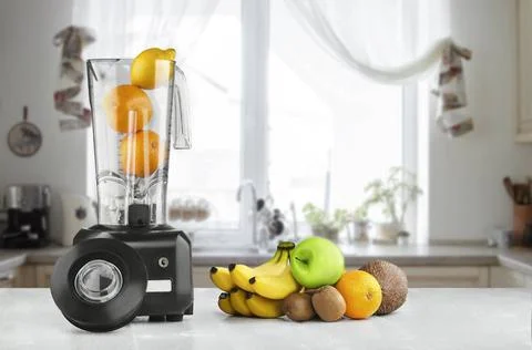 Blender, fruits and kitchen space The electric blender for make fruit juic... Stock Photos
