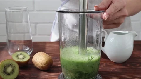 Blender grinding of spinach, smoothies with vegetable milk. Stock Footage 197844552