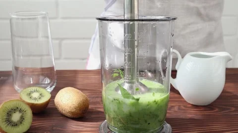 Blender grinding of spinach, smoothies with vegetable milk. Stock Footage 200786178
