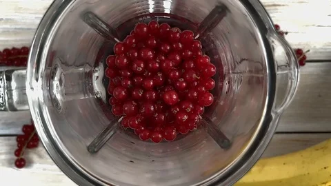 Blender is shaking red currant smoothie, top view Stock Footage 115340123