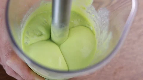 Blending Avocado Chunks In A Hand Blender Stock Footage 160114375