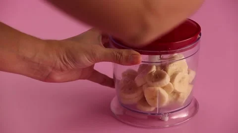 Blending banana in a blender 스톡 동영상 133810751