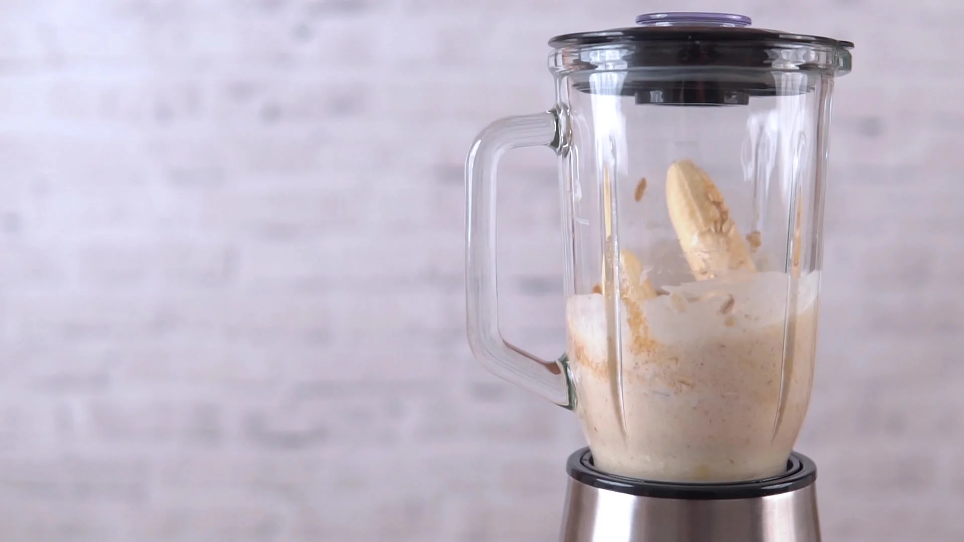Premium Photo  Man pouring nondiary milk in blender with cut bananas when  making smoothie
