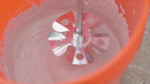 Blending ceiling texture compound in orange bucket. Stock Footage 149796429