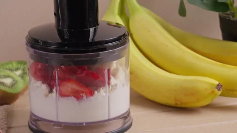 Blending cottage cheese strawberry and banana in food processor 스톡 동영상 344121737