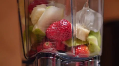 Blending Fruit in a Blender Stock Footage 83744854