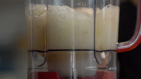 Blending pineapple juice in slow motion Stock-Footage 128003416