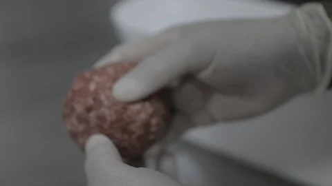 Blending Raw Meat for a Burger Stock Footage 128754929