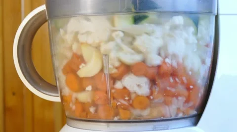Blending vegetables in blender, close up Stock Footage 68045552