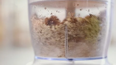 Blending walnuts in a blender. Stock Footage 153457179