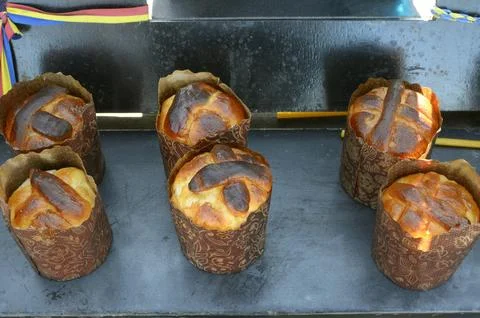 Blessed Easter breads are placed near portraits of protesters killed during t Stock Photos
