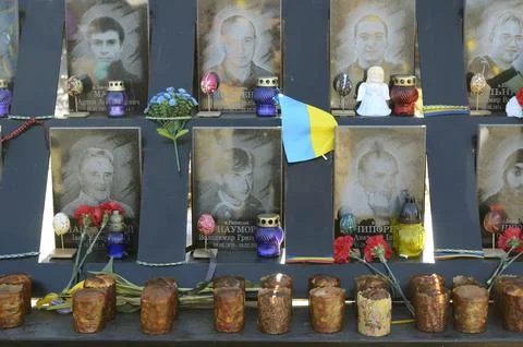 Blessed Easter breads are placed in front of portraits of protesters killed.. Stock Photos