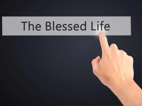 The Blessed Life - Hand pressing a button on blurred background concept . Bus Stock Photos