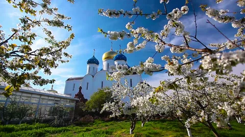 Blessed place, church in background, spring garden Stock Footage 37863102