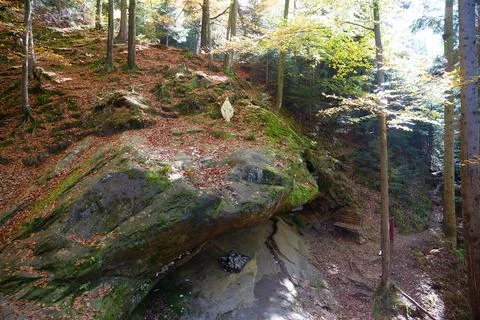 Blessed Stone and sacred spring in forest near Manyava Skete in Ukraine Stock Photos