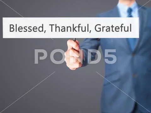 Blessed Thankful Grateful - Businessman hand holding sign Stock Photos