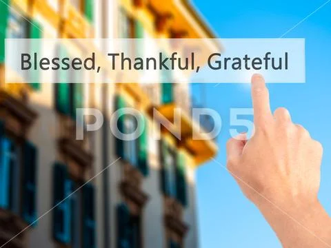 Blessed Thankful Grateful - Hand pressing a button on blurred ba Stock Photos