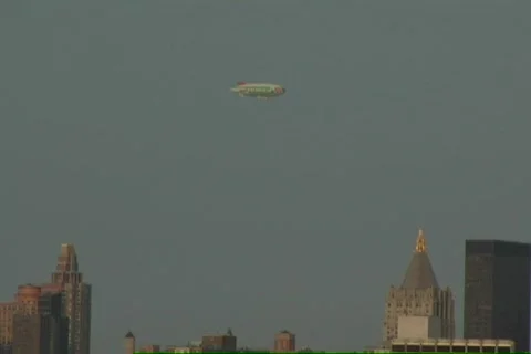 Blimp Flys Over Manhattan Sunset Timelapse Stock Footage 81759