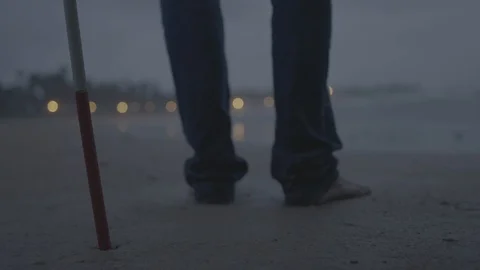 Blind Man with a cane on a beach Stock-Footage 90610474