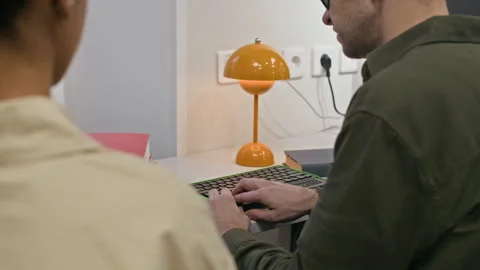 Blind Man Learning to Use Braille Display on Computer Keyboard Stock Footage 327459044