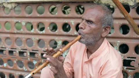 Blind man playing flute Video stock 136740111