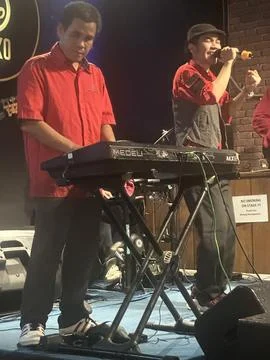 Blind man playing keyboard Foto stock