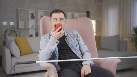 Blind man talking on the phone. Video stock 228823376