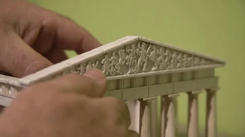 Blind man touching a copy of the Parthenon 스톡 동영상 140989928