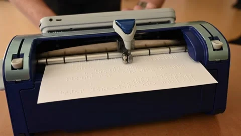 Blind man using braille typewriter. Stock Footage 179439941