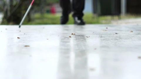 Blind man waliking with white cane Stock Footage 148643230