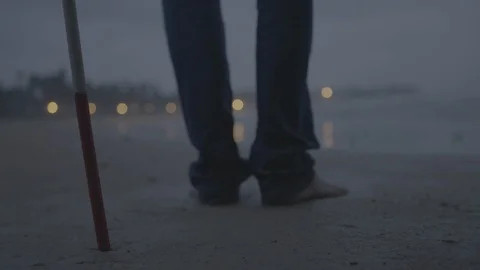 Blind Man walking away from the cane on a beach 動画素材 90610882