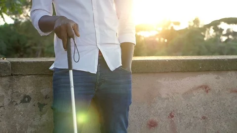 Blind man with walking stick at sunset. Blindness, autonomy,stick Stock Footage 119869653