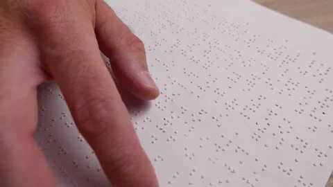 Blind Men Is Reading a Braille Text From a Paper With His Fingers 스톡 동영상 164411720