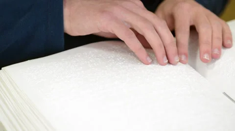 Blind or visually handicapped reading book Video stock 34639459