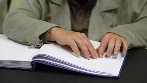 Blind person reading a book Stock Footage 241709075