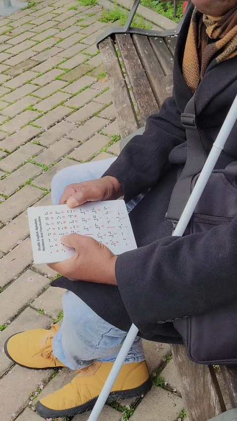 Blind person reading the Braille reading code with his fingertips. (2) Stock-Footage 306017971