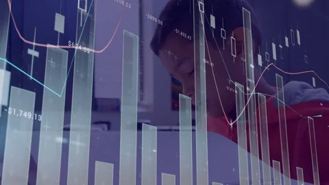 A blind schoolboy is sitting at desk 4k, side view, reading a braille book in Stock Footage 329924018