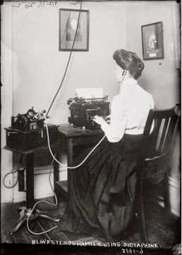 Blind stenographer using dictaphone. Foto stock