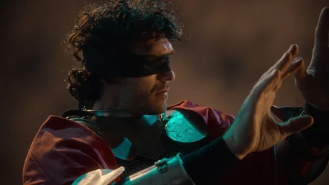 Blindfolded Man in Medieval Armor Sensing Energy with Hands Stock Footage 345506434