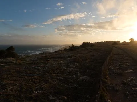 Blinding effect at sunset with blue sky and clouds in Leucate Stock Photos