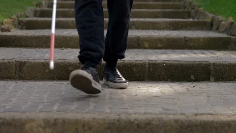 Blindness, autonomy,orientation. Blind person going down stairs- outdoor Stock-Footage 120520342