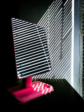 The blinds are reflected in the mirror Stock Photos