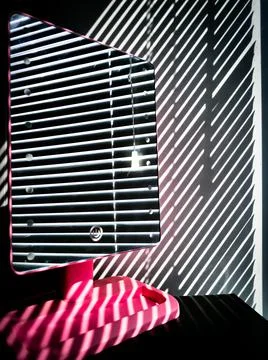 The blinds are reflected in the mirror Stock Photos